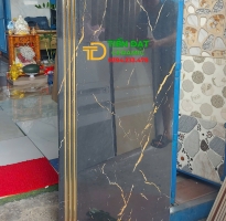 Gạch Lót Cầu Thang TQ 47x120 Đen Vân Cam Khắc Kim 